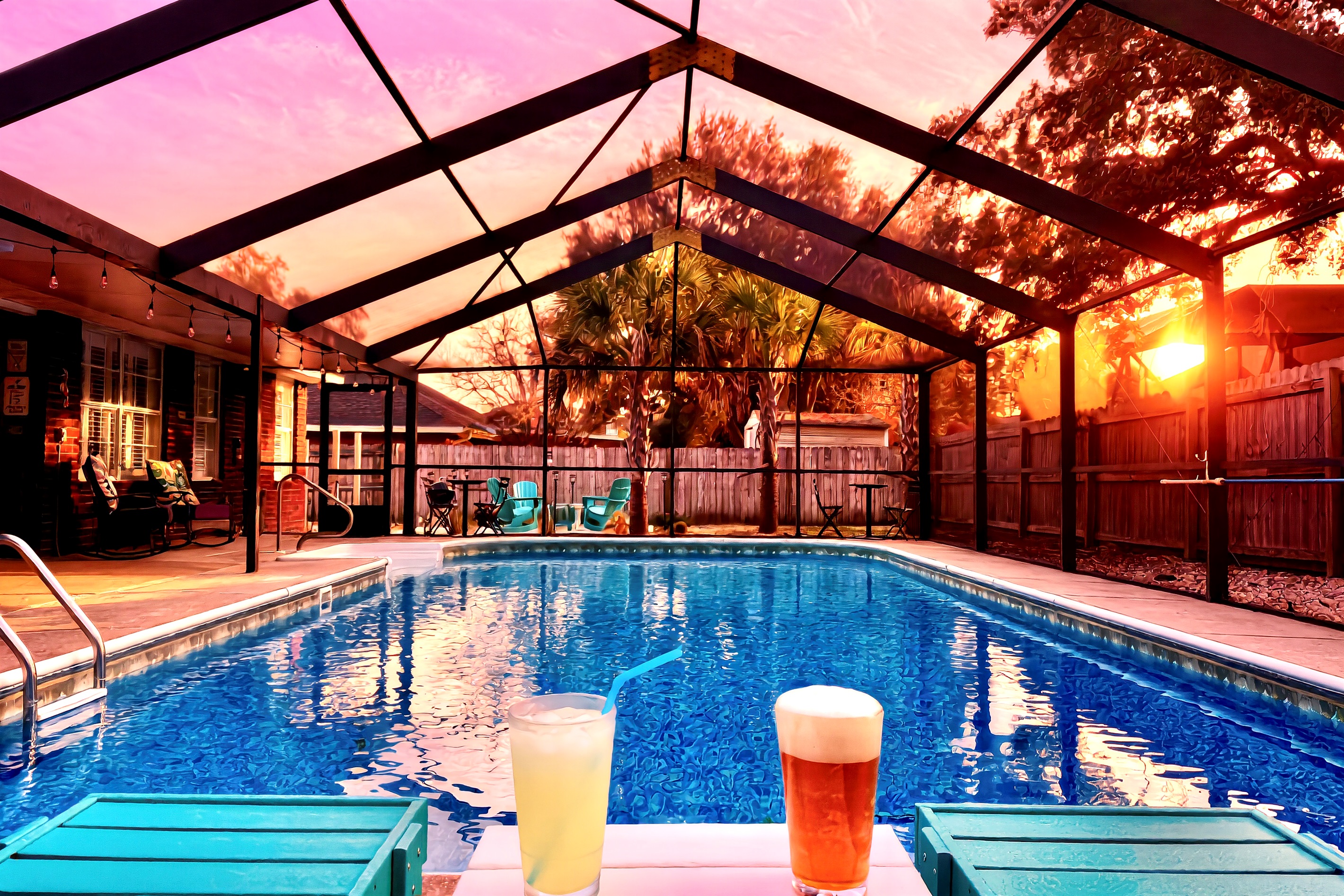 Relax and soak up the sunset with a cold beverage in Polywood chaise lounges next to the gorgeous, screened-in, and the heated (year round) pool. Cheers!