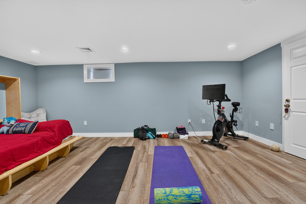 A spacious recreation area perfect for relaxing, exercising, or spending time together.