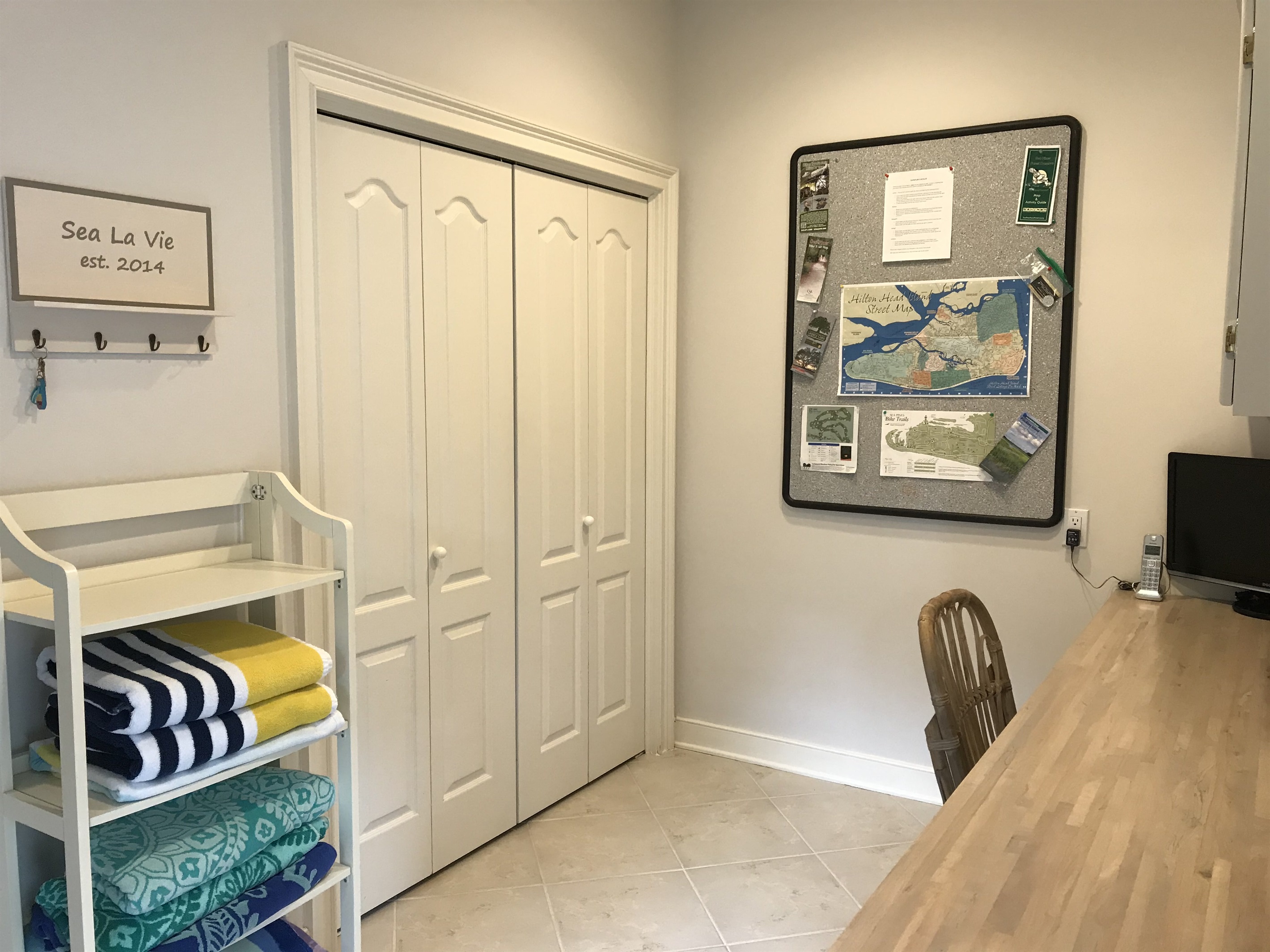 Laundry closet with full size washer and dryer, beach towels provided for your convenience