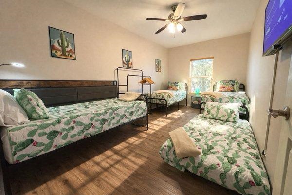 Twin XL Room now sleeps 4 with TV opposite the day bed