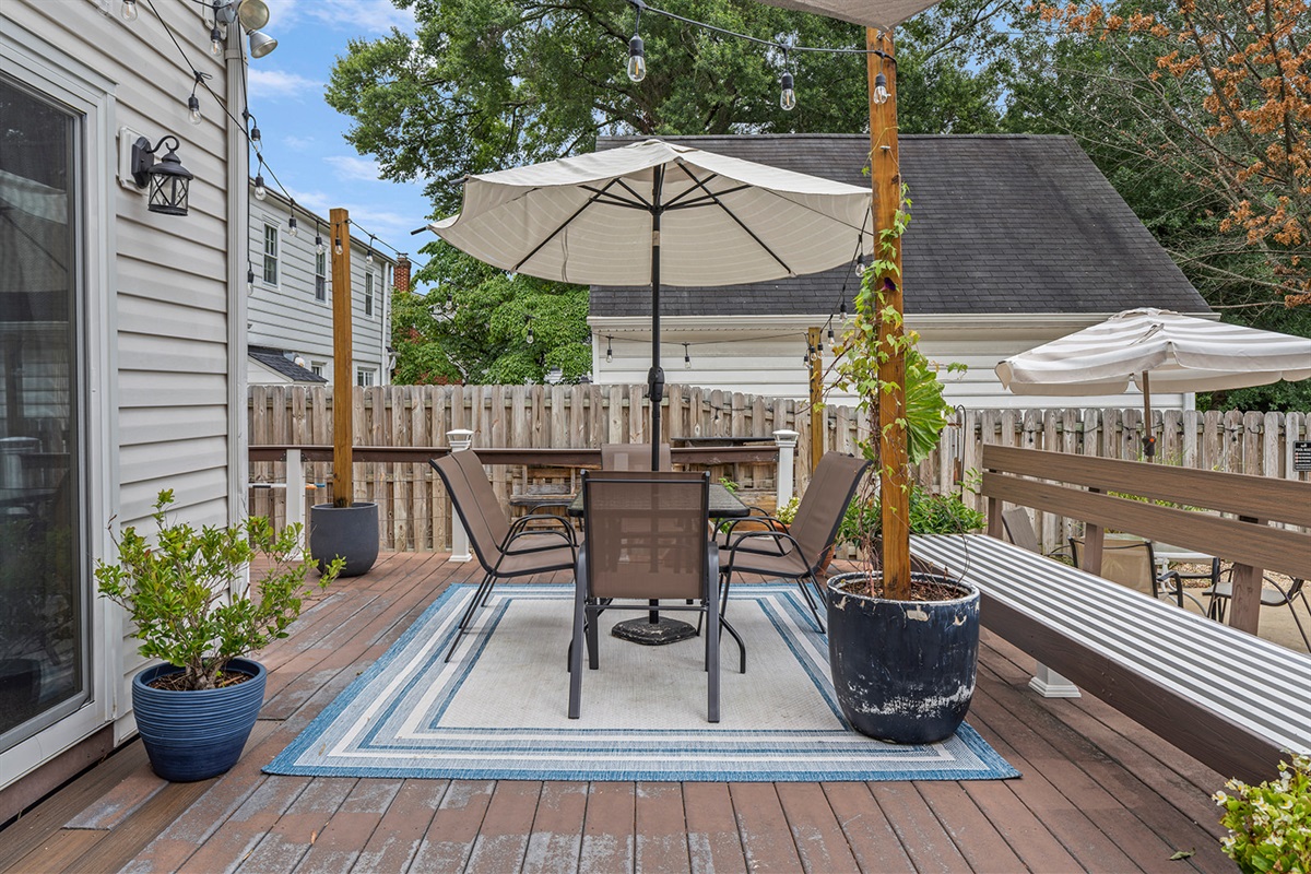Outdoor Retreat: Gather under the sun with friends on this chic deck, perfect for al fresco dining!