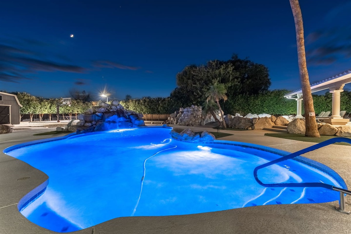 Chic and serene: unwind beside your private waterfall pool under the Arizona night sky.

