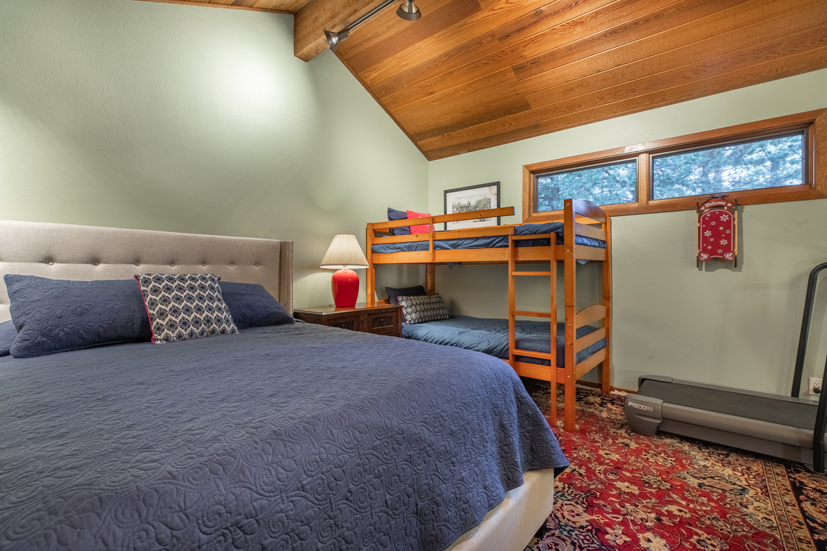Cozy loft retreat with Queen bed, bunk beds, leather sofa, and Roku television.
