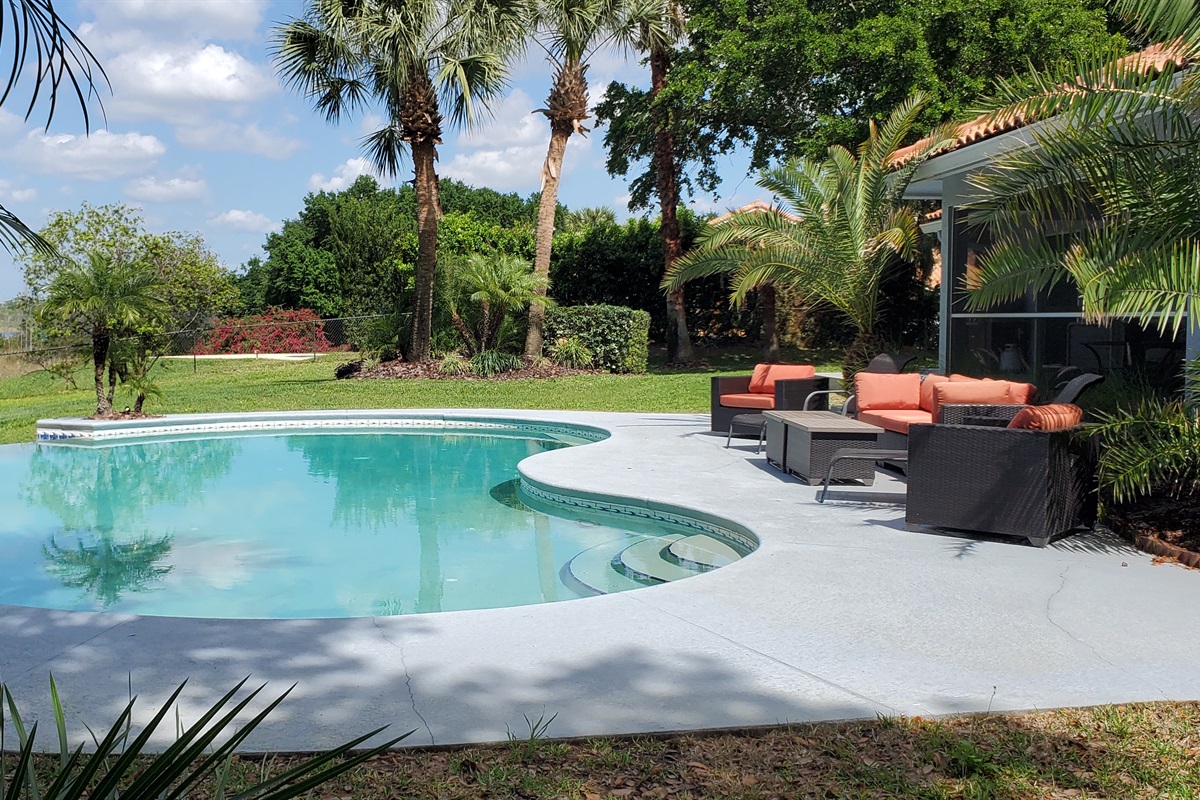 Sunset Cove pool, deck and comfortable outdoor seating