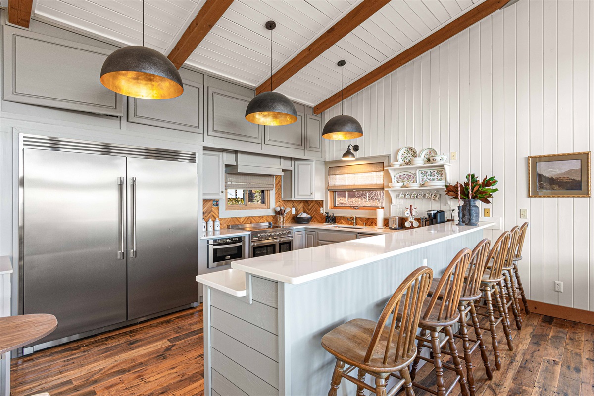 Chef’s kitchen with oversized island, premium appliances, and seating for the whole crew.