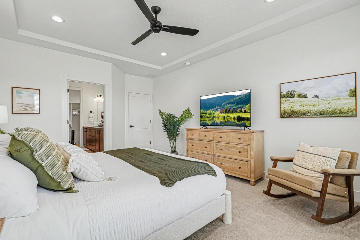 Enjoy a peaceful night’s sleep in the spacious master bedroom, complete with a California King bed and Smart TV.