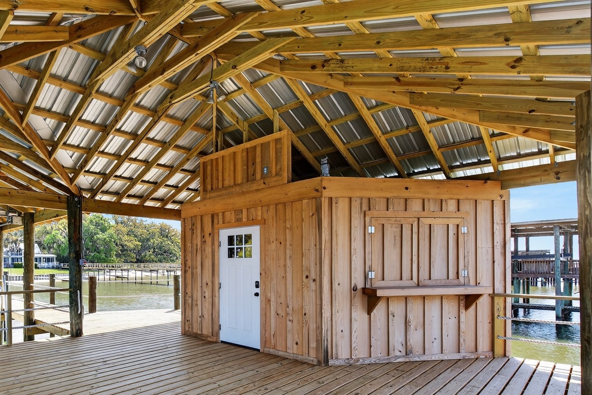 Covered dock area with shaded space to relax above the water