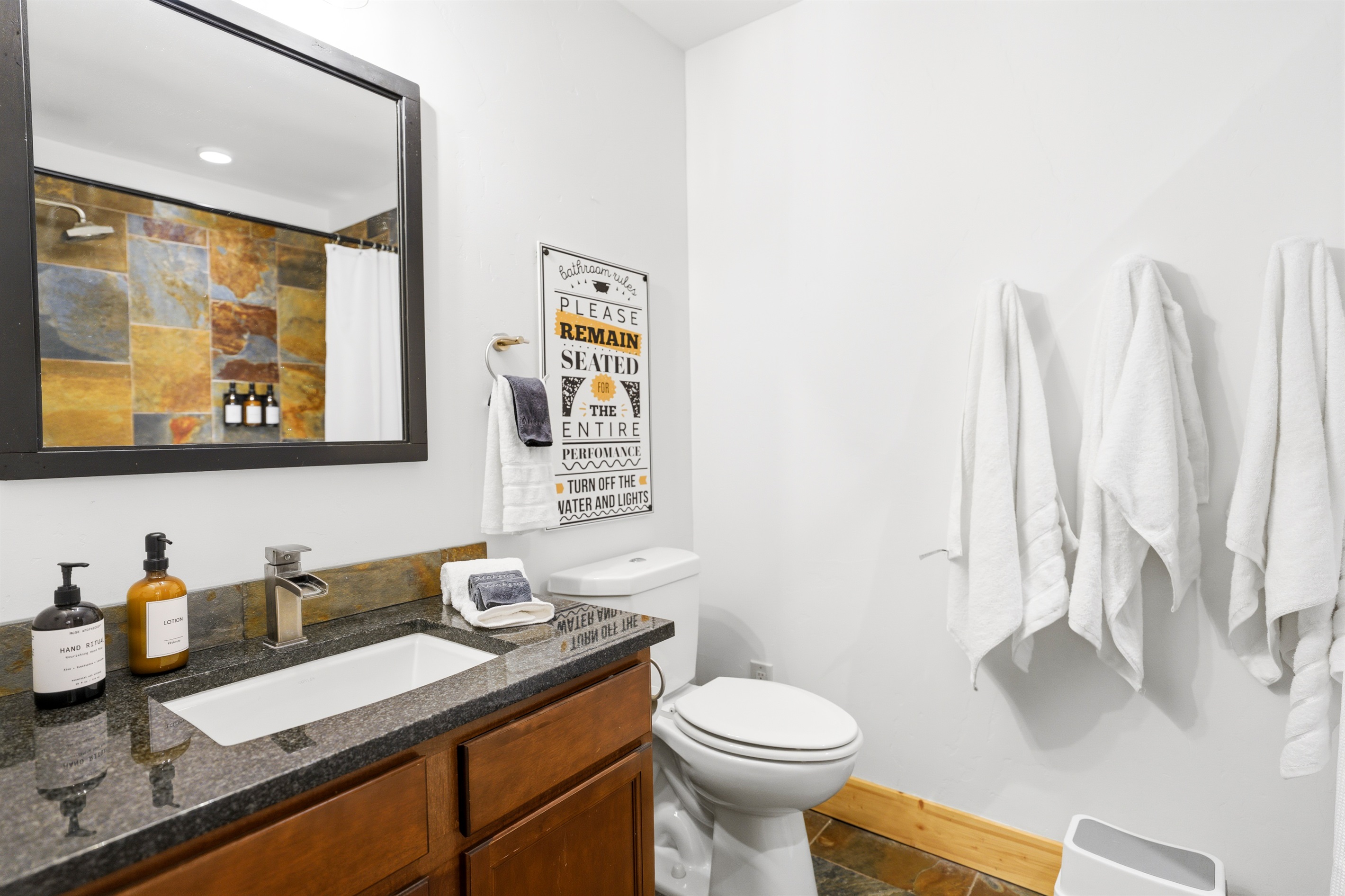 Just off the 2 main floor bedrooms is the other full bathroom...A perfect blend of modern comfort and mountain charm, right down to every detail.