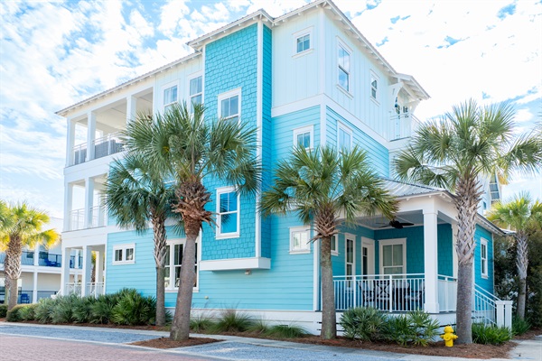 House has 4 separate outdoor living area with chairs, dining tables, firepit, section, and grill