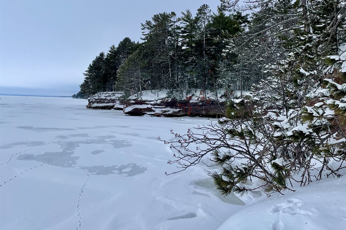 Houghton Falls Trail in Washburn, WI a 20 min drive from the cottage. A 30 minute hike with seasonal waterfalls, sandstone cliffs, and runs to the shoreline of Lake Superior with sea caves. 