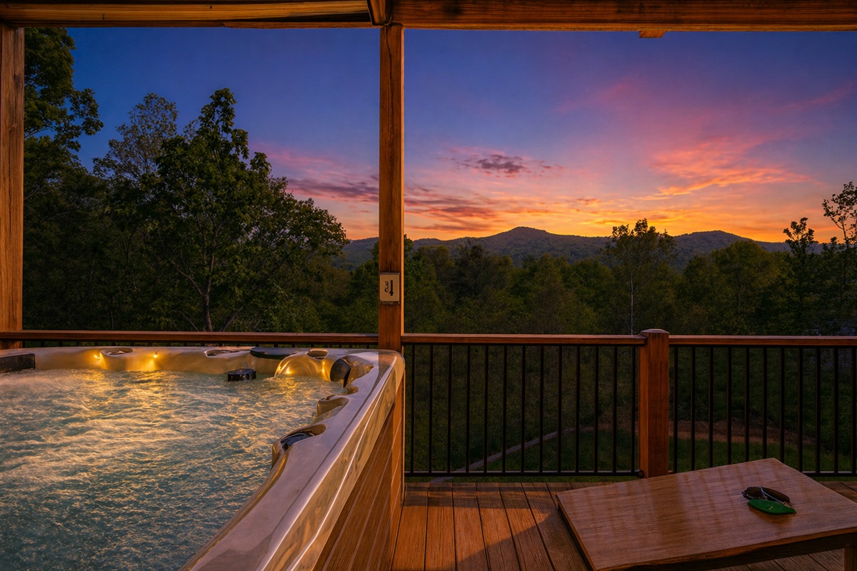 Sunset soaks the mountains in gold while the hot tub bubbles under a painted sky—this is what unwinding is supposed to feel like.