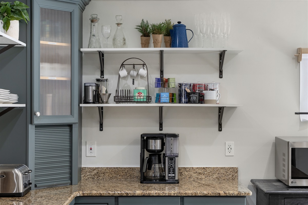 Variety of coffee making options, including a large coffee pot.