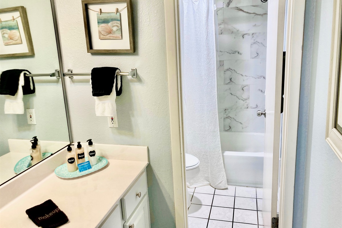 The en suite master bath has lots of room for all of your things! As well as a tub/shower combo!