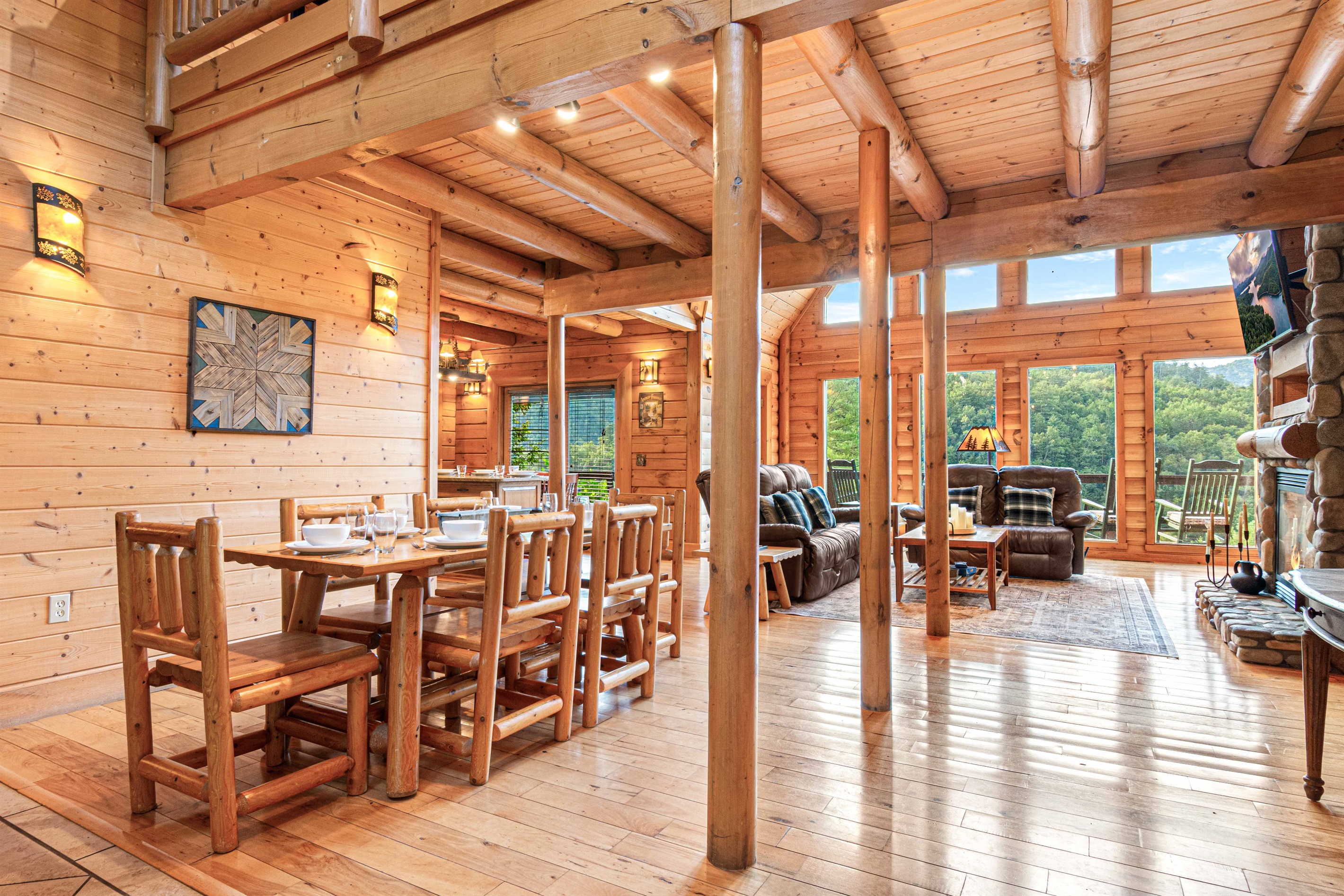 Main Level Dining Room: Gather around the rustic wood table with stunning views of the lush outdoors!