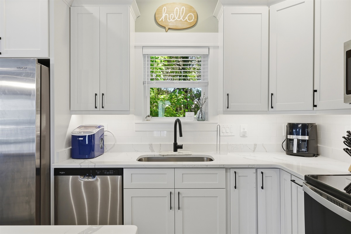 Bright and functional kitchen featuring plenty of cabinet and prep space