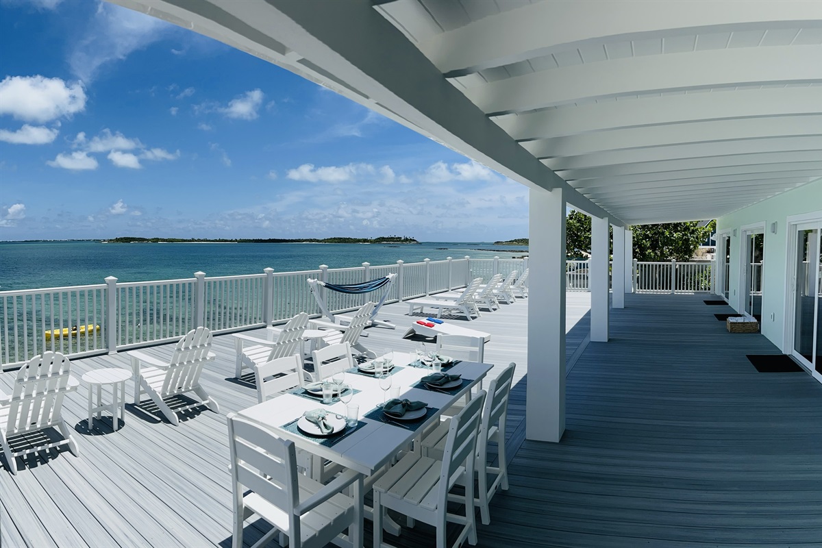 STARFISH BAY Outdoor dining table for six and high table for four. Enjoy both the covered and uncovered outdoor areas with breathtaking views.