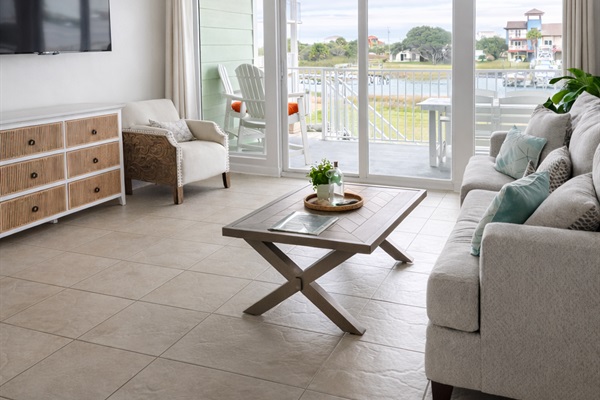 Sun-filled waterfront living space with private balcony