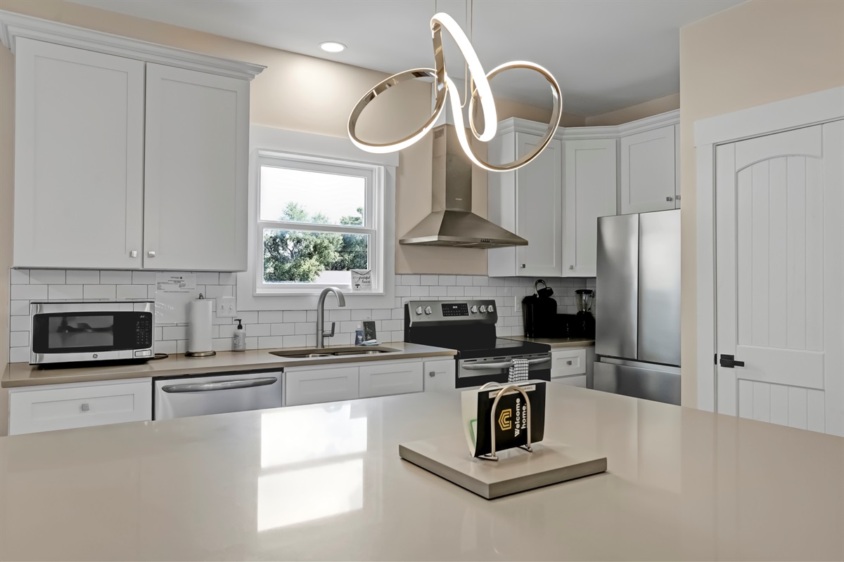 Stylish, unique lighting adds warmth and character to the kitchen.