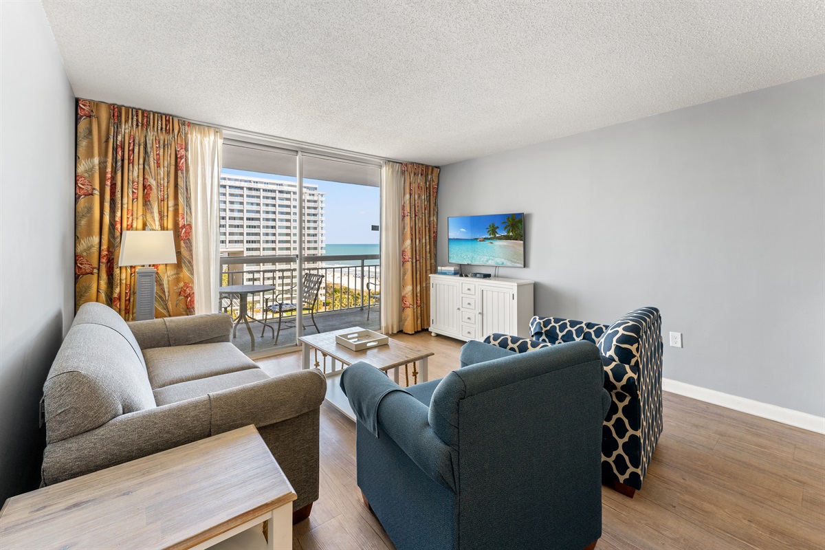 Spacious Living Room with sleeper sofa and  balcony access