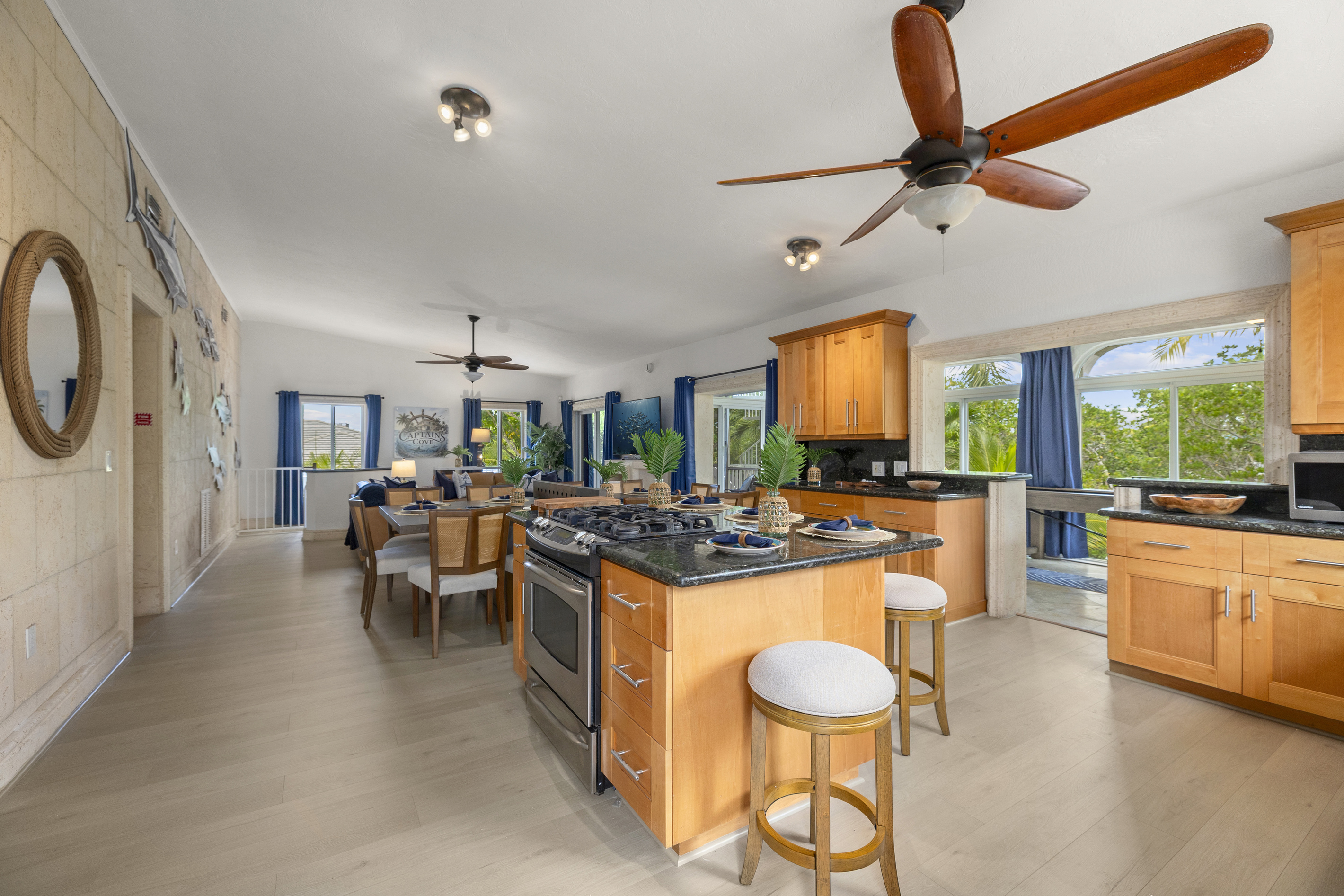 Large custom kitchen opens up to the kitchen and dining area.
