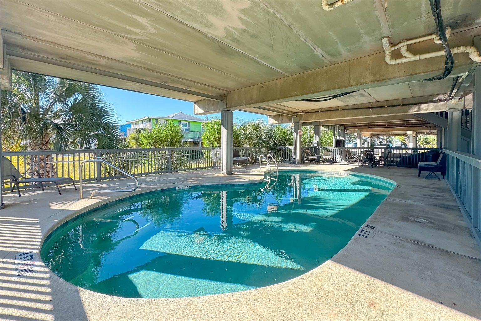 Pool area.  Partial sun with partial shade.  You can still enjoy this sense of water during a rainfall unlike the ocean.