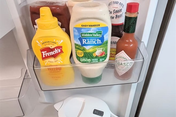 Filtered water pitcher and basic condiments for guest use including: ketchup • mustard • ranch • bbq sauce • mayo • hot sauce