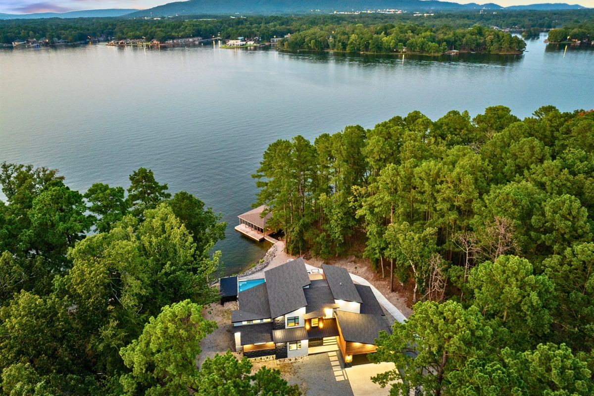 A bird’s-eye view of your secluded lakeside escape surrounded by nature.