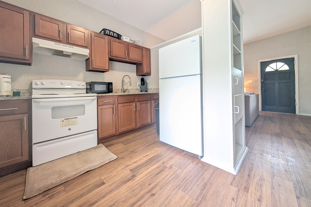 Full kitchen with oven and refrigerator
