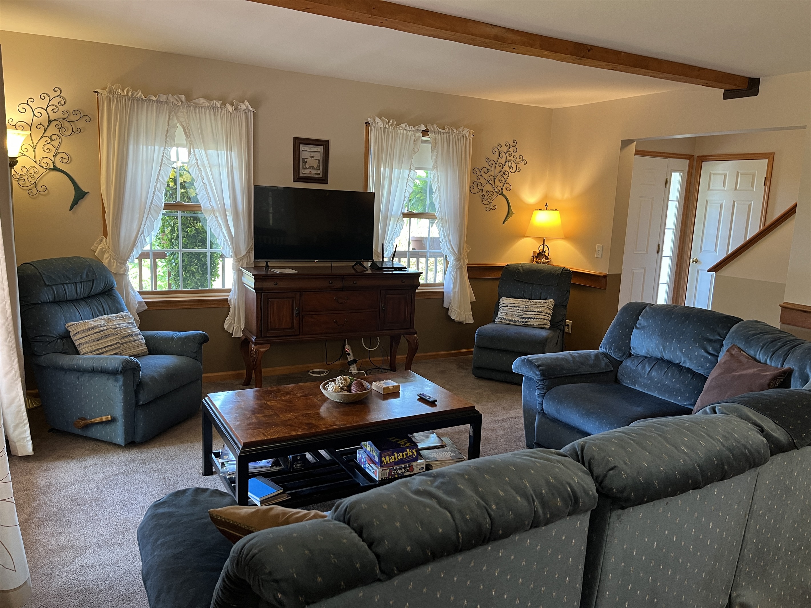 Living room with sectional and TV