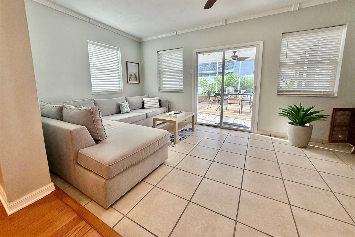 Kick back in comfort after a day of exploring—the space is tailored for relaxation with a large TV, soft lighting, and comfortable seating.