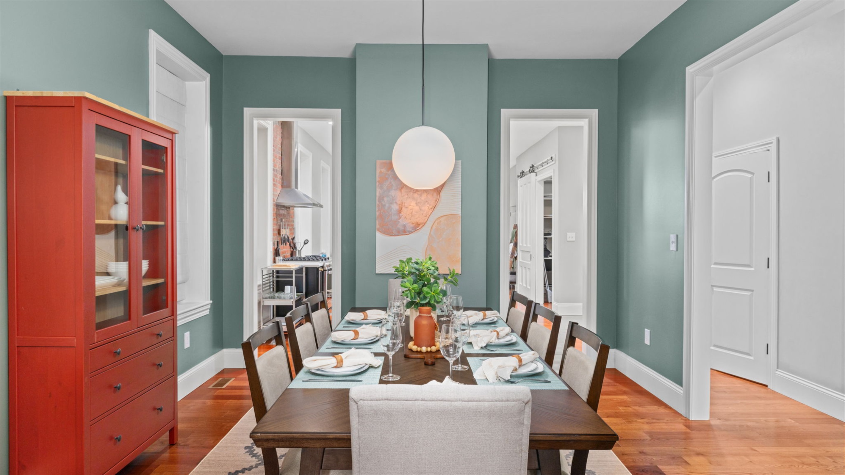 Comfortable seating for 8 in the dining room.  A convertible high chair and booster seat are also available in the corner.