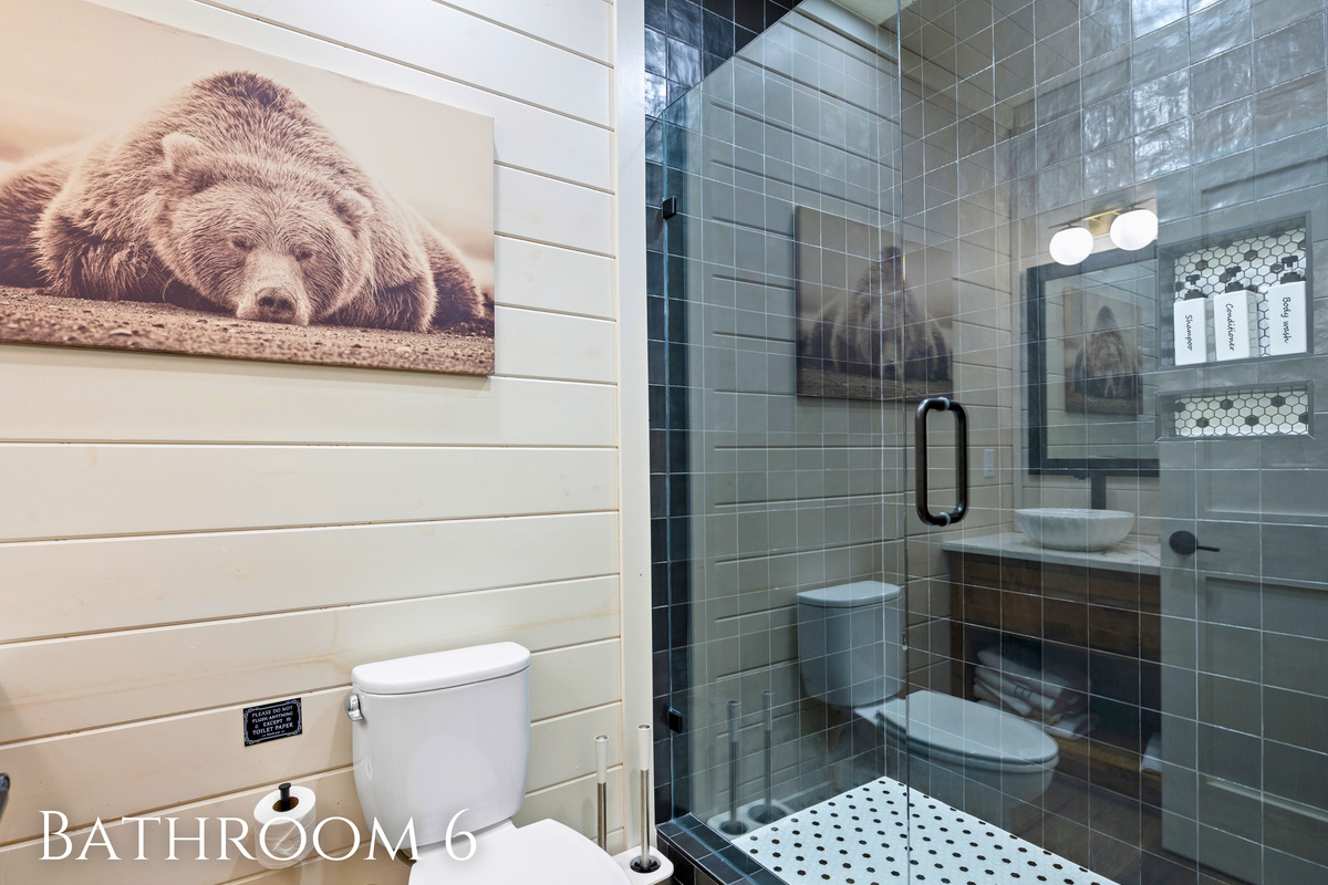 After a day filled with outdoor adventures and games, this full bathroom offers a comfortable place to refresh and get ready for the next day.