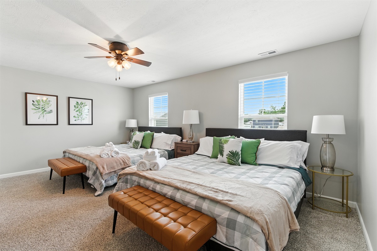 Stylish master room with two king beds for maximum comfort
