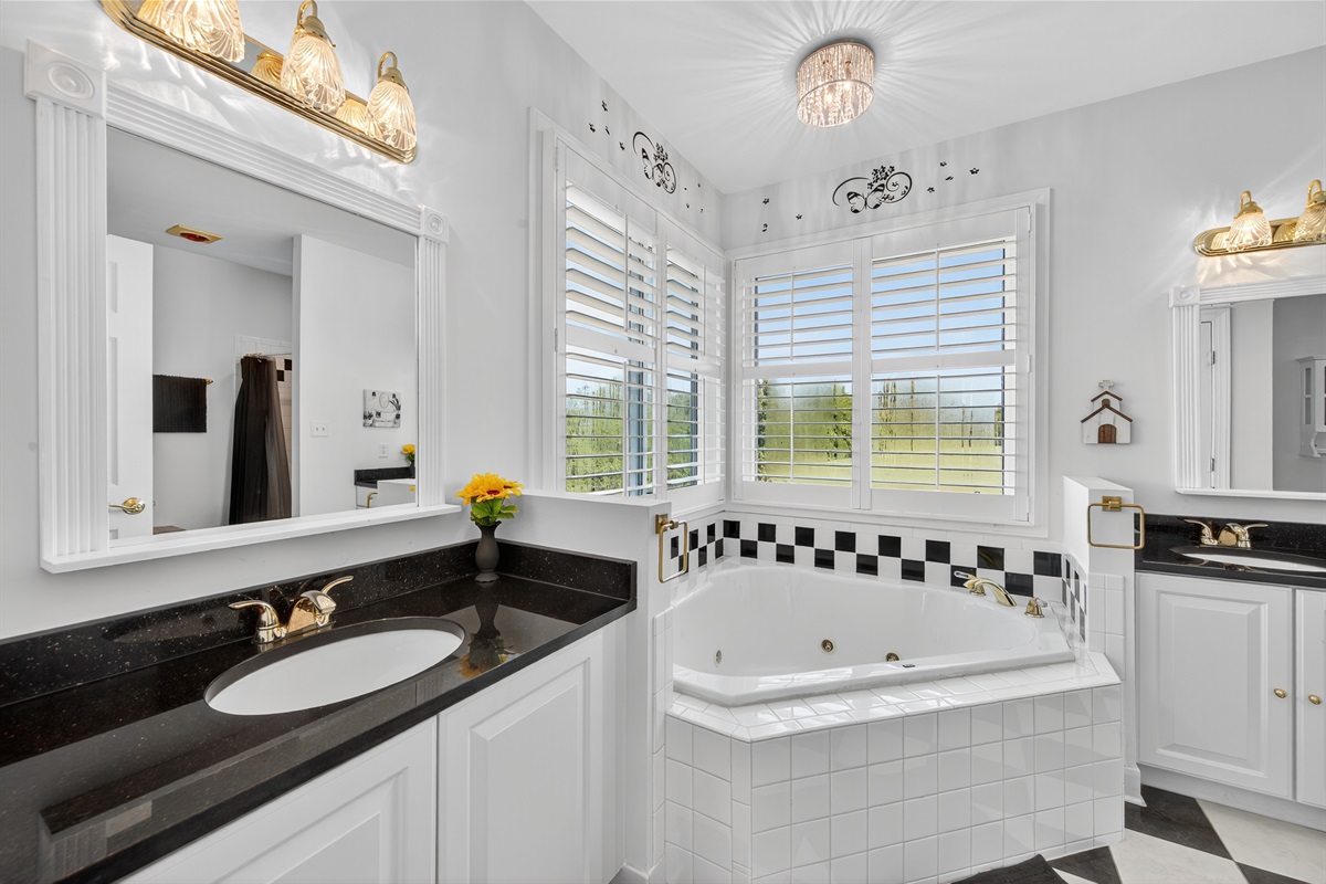Relax and unwind in this bright primary bath.