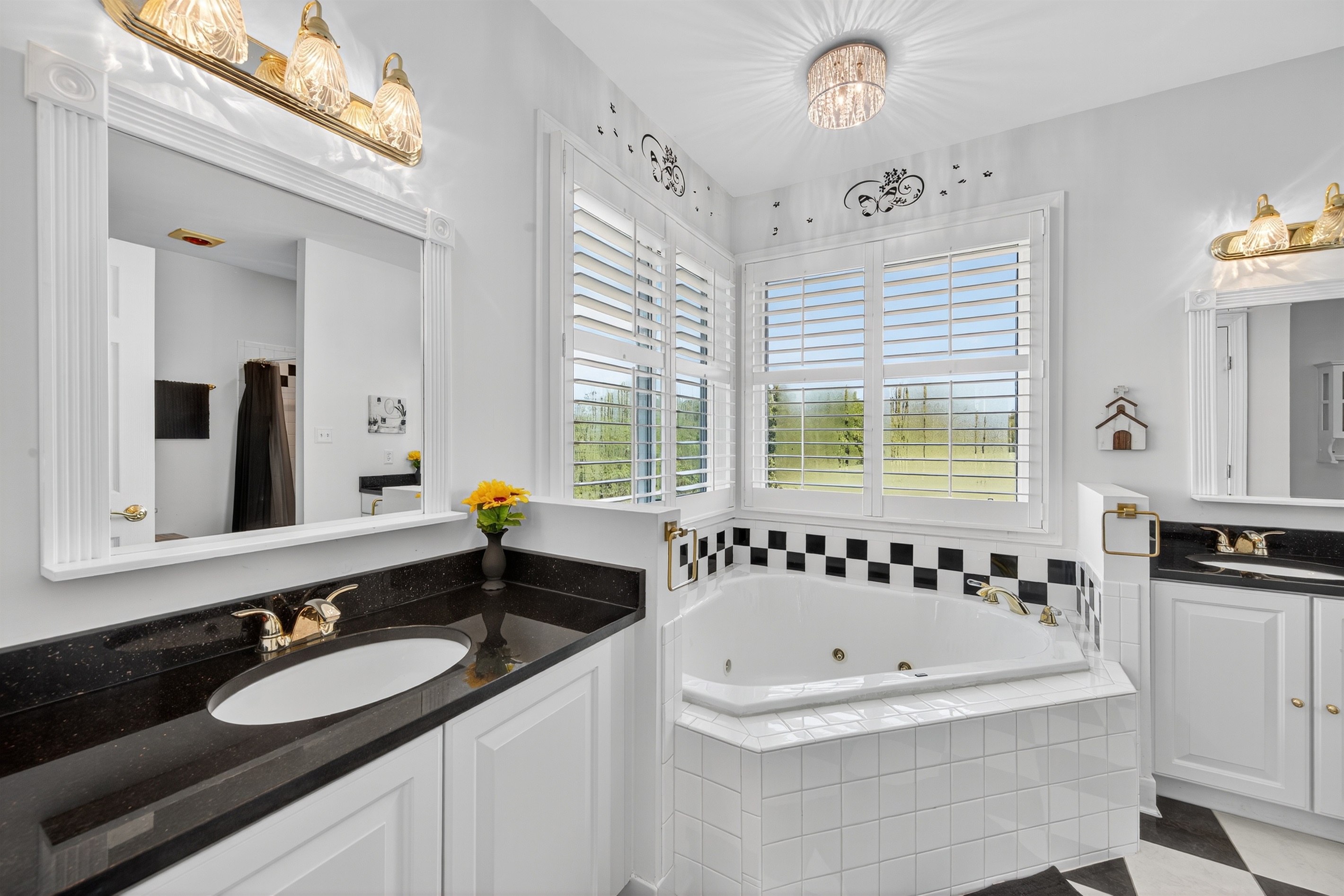 Relax and unwind in this bright primary bath.