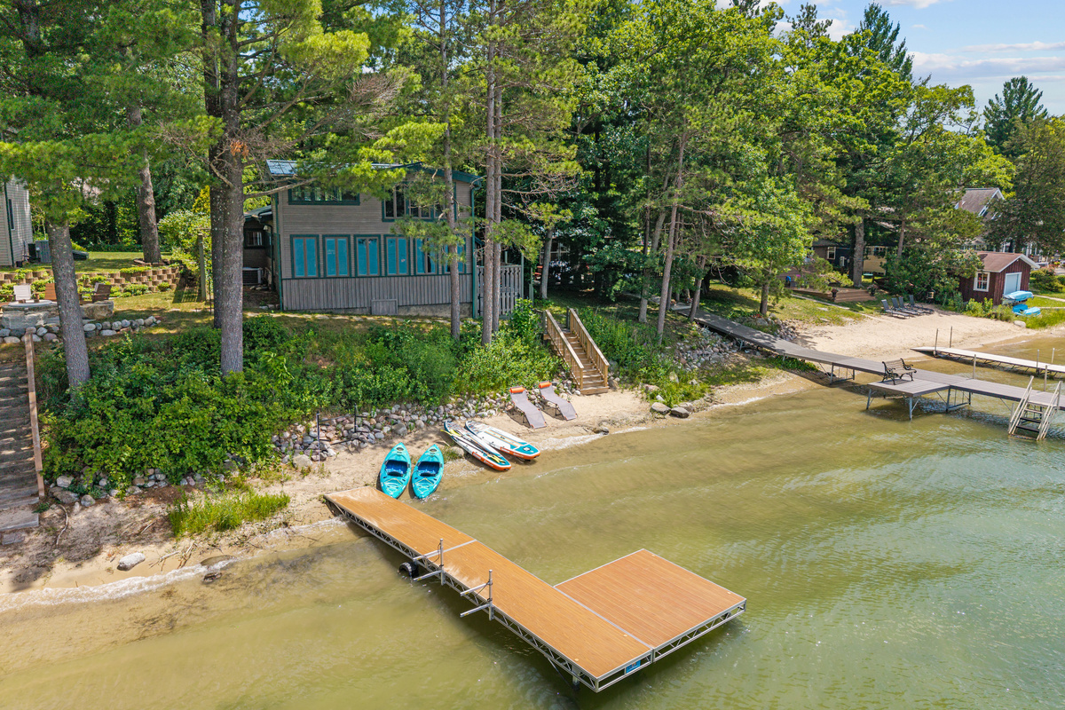 Welcome to your home away from home—a private lakeside escape with a sandy beach, complimentary water toys, and breathtaking views.