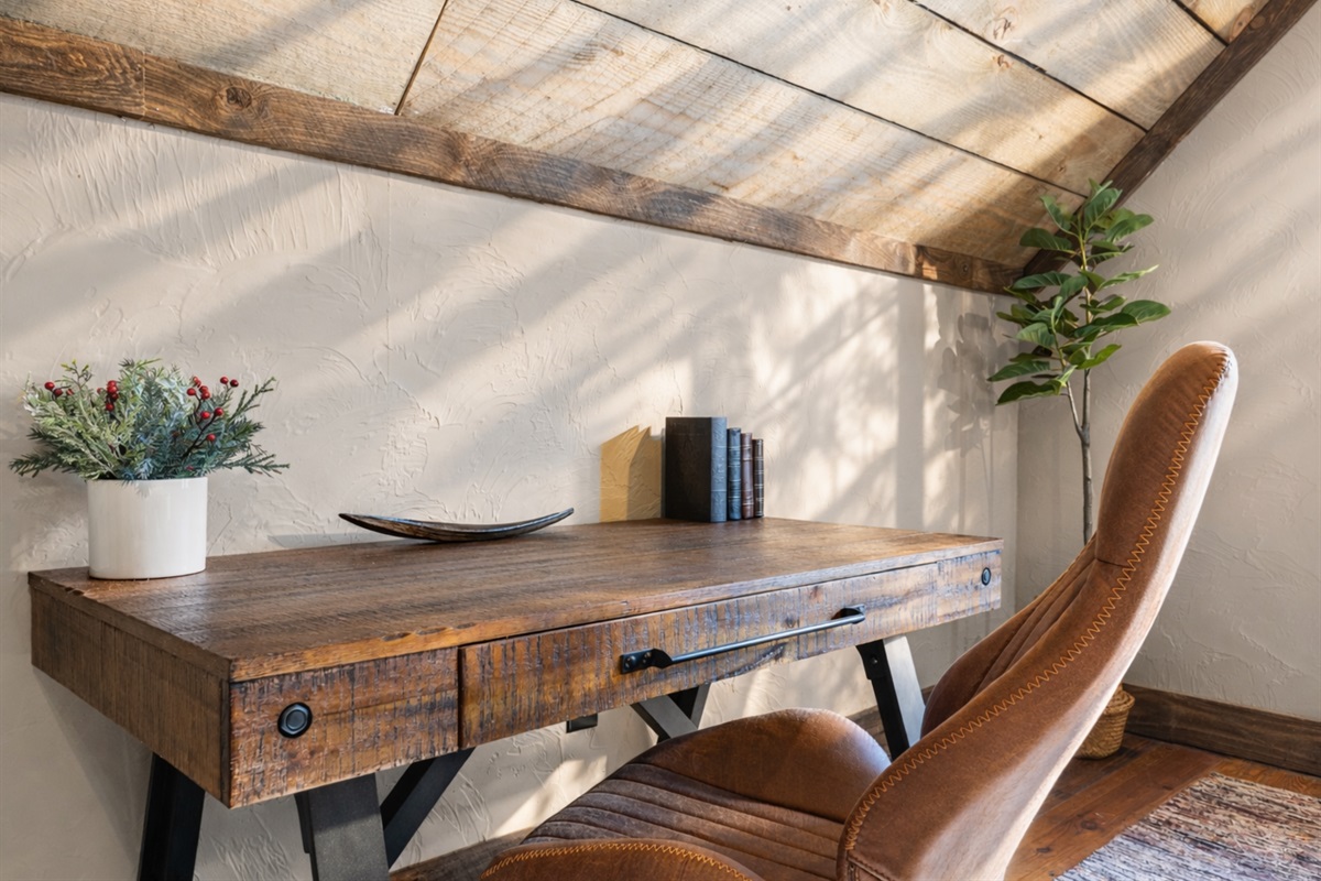 A cozy desk nook provides a quiet space for work or creative inspiration.