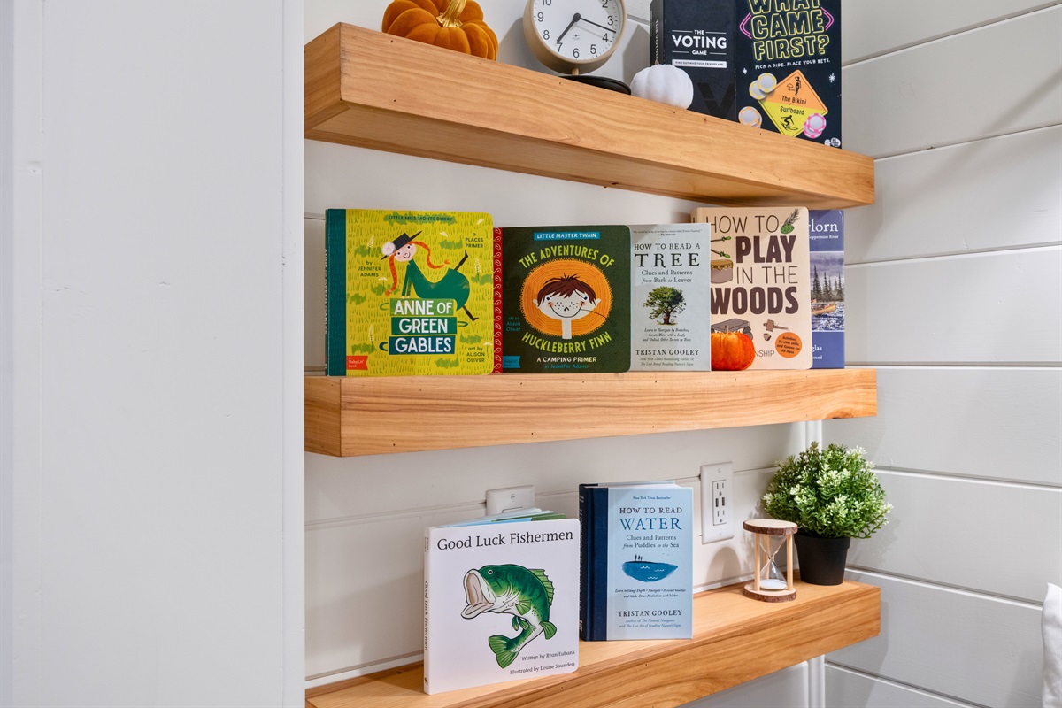 Built-in shelving with books and decor for quiet reading.