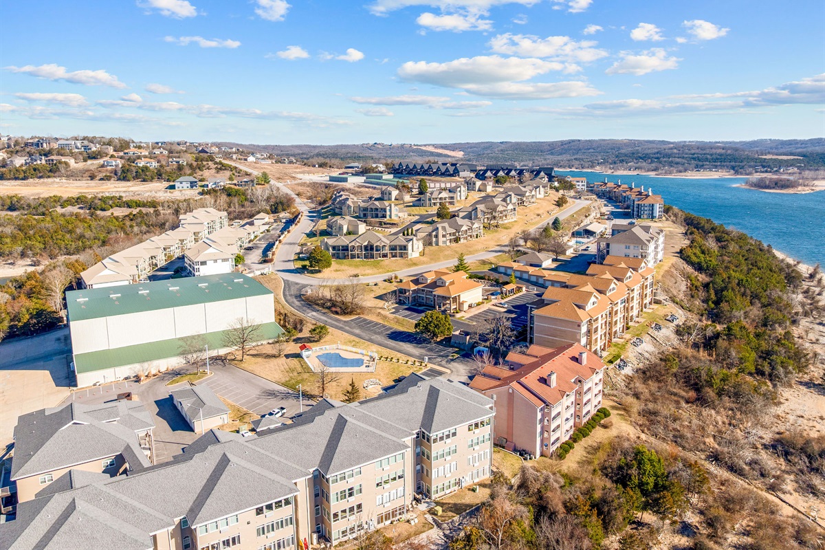 Sweeping aerial view of the lakeside community and surrounding hills.