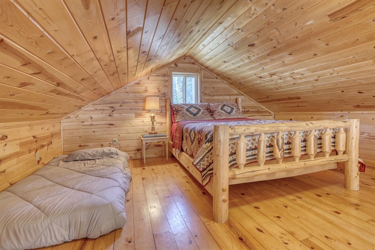 Loft area with queen bed and twin bed