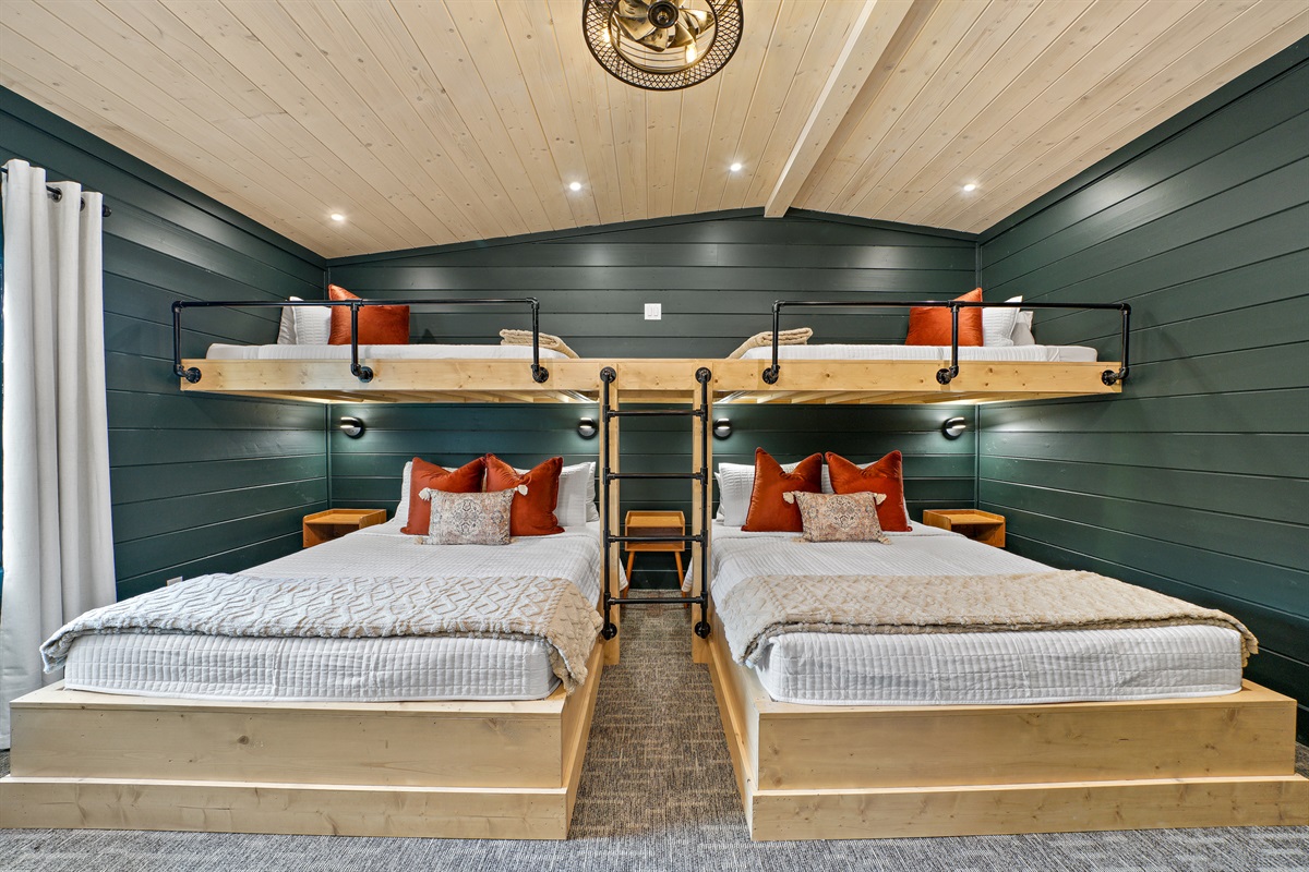 Outfitted with a custom bunk unit, the cozy bunk room has (2) two twin beds over (2) two queen beds. 