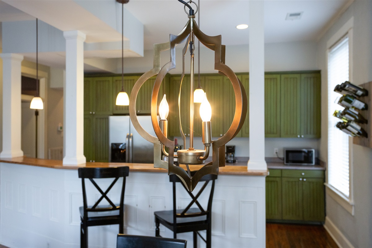 A bold chandelier adds drama and elegance to the heart of the home.
