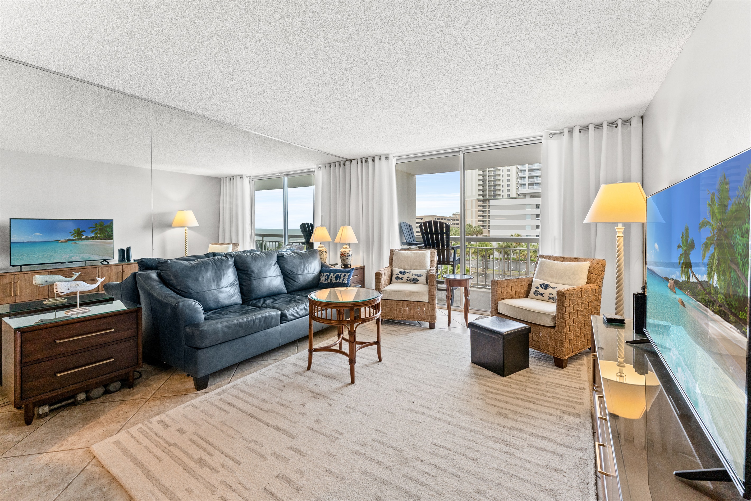 Spacious Living Room  with large TV and balcony access