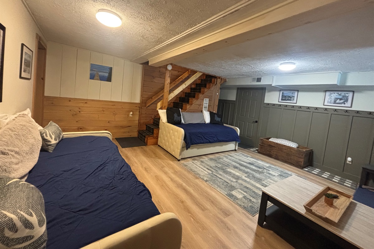 Lower level sitting area with day beds and trundles