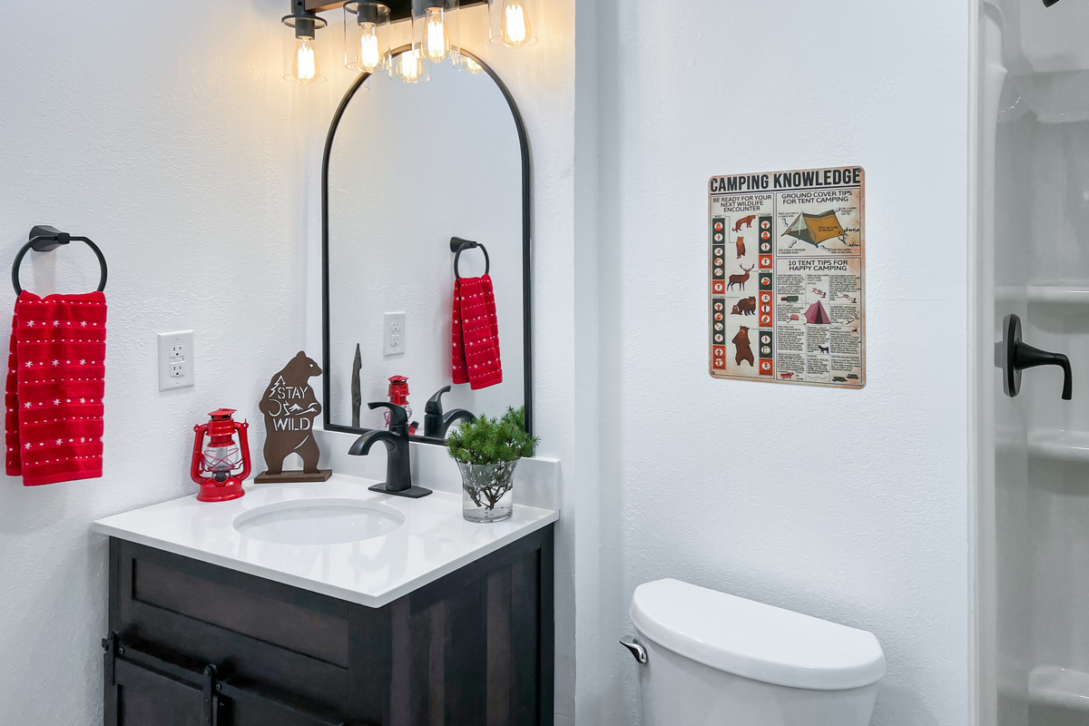 Lower-level full bathroom provides convenient access from the bunk room and entertainment area.