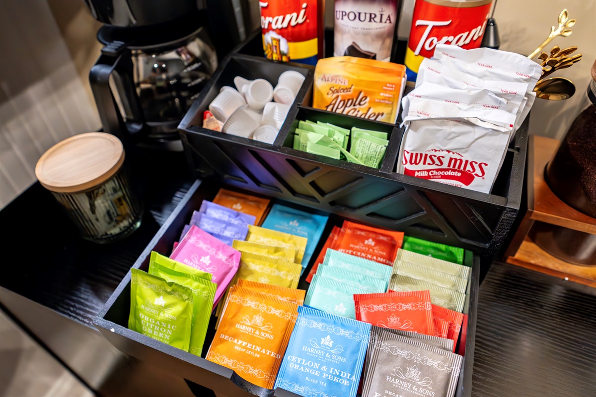 Stylish, well-stocked coffee bar with K-pod, Nespresso, drip, and French press — plus full selection of teas, artisan syrups, and sweet sips for every guest