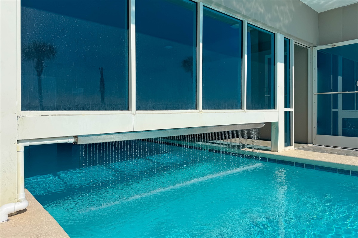 Outside pool - Experience the best of both worlds at Tradewinds Beachfront Condo with our one-of-a-kind indoor/outdoor transition pool.