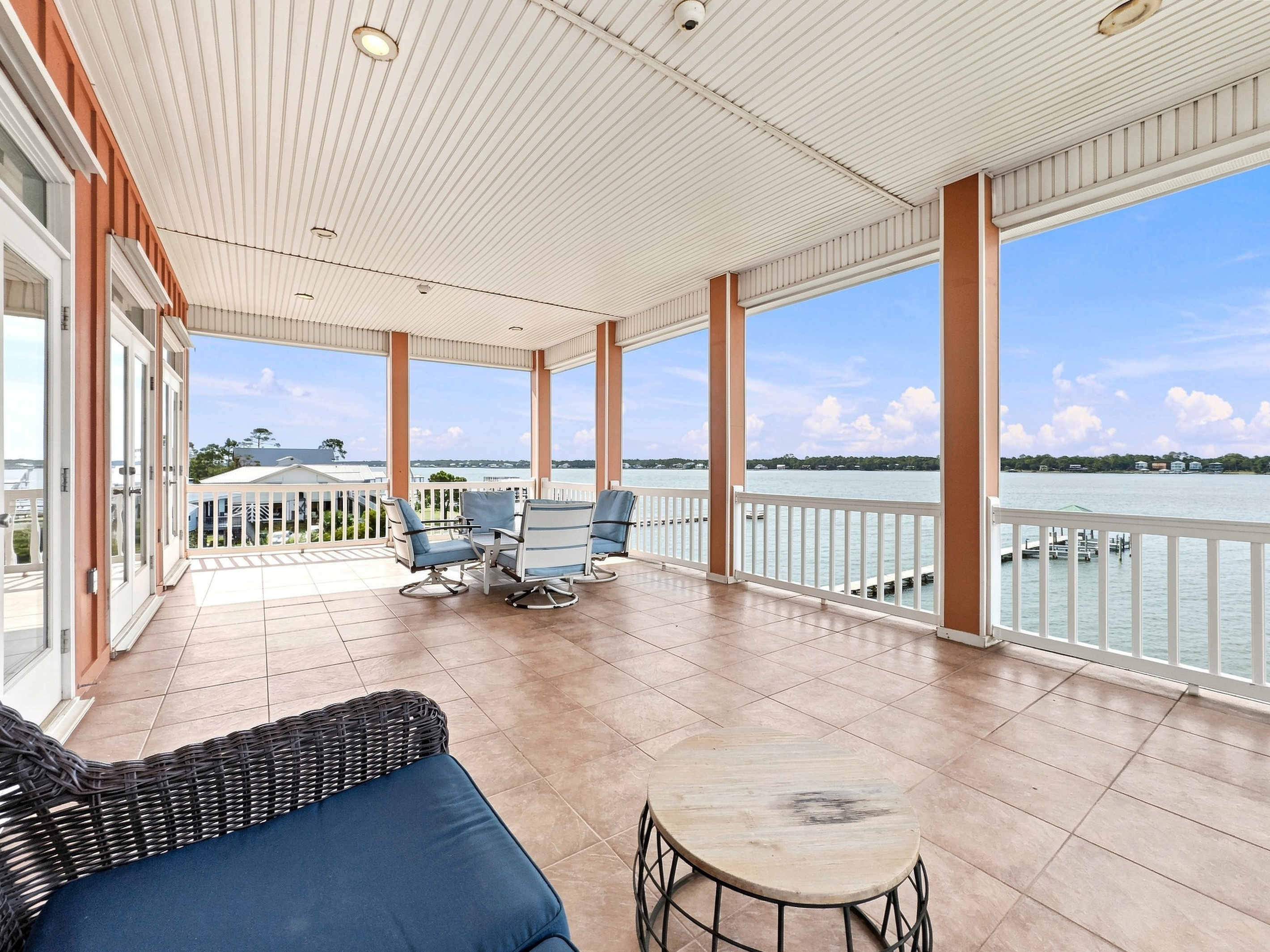 Expansive covered balcony with panoramic lagoon water views