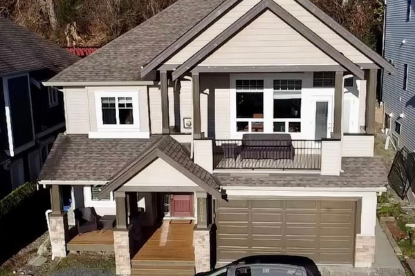 This picture is taken from a drone 
and show’s the whole house.
The parking for the suite is on the left on the gravel. 
The walk way to the suite is on the right of the garage.