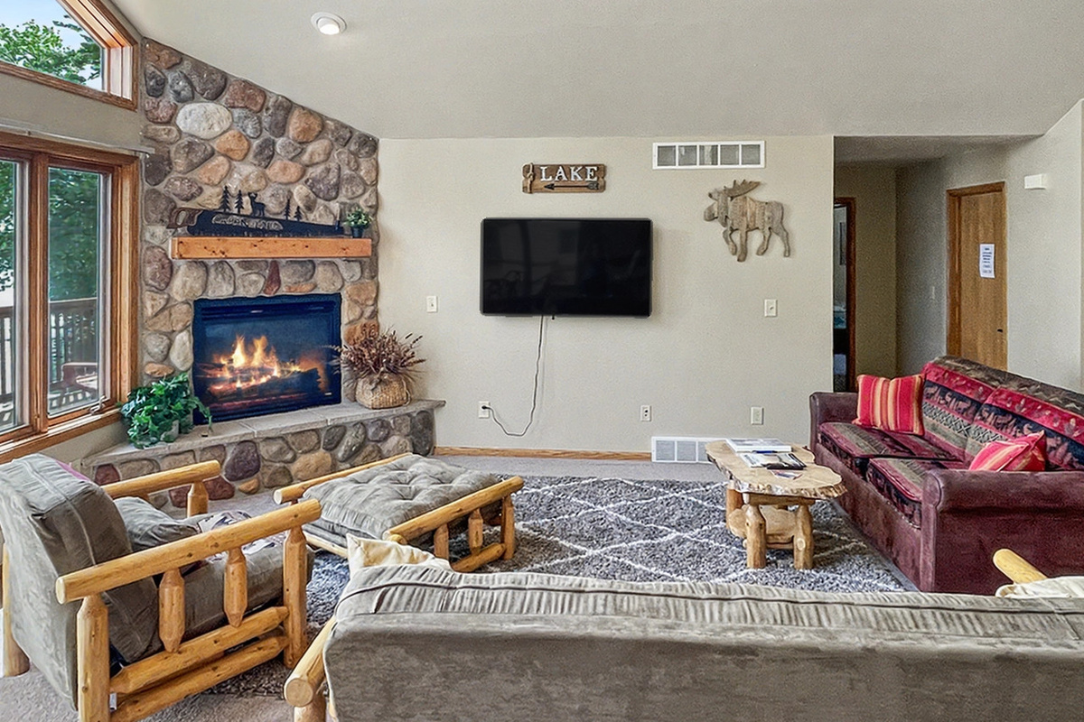 Living Room - Lower Level with TV and Fireplace